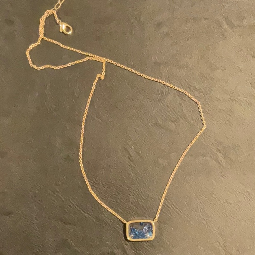 Goldstone necklace with blue and clear stones inside